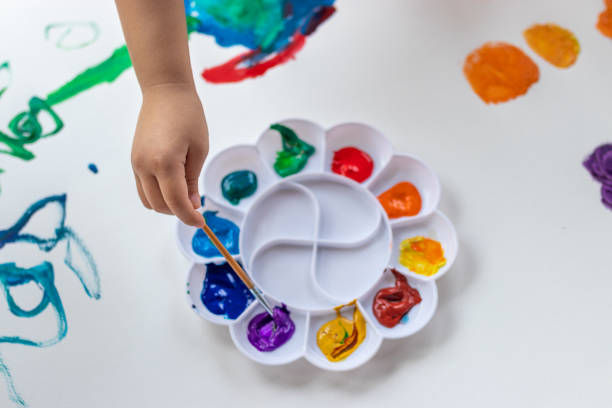 istock Child paint with watercolors. Education concept. 1250036201