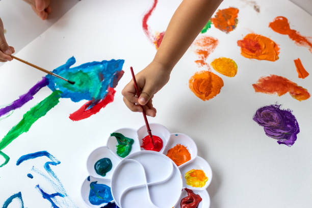 istock Child paint with watercolors. Education concept. 1250036286