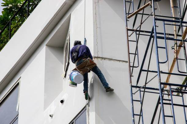 Asian Painter hanging by rope for fixing and painting exterior Asian Painter hanging by rope for fixing and painting exterior building wall. Selective focus. house painting service stock pictures, royalty-free photos & images