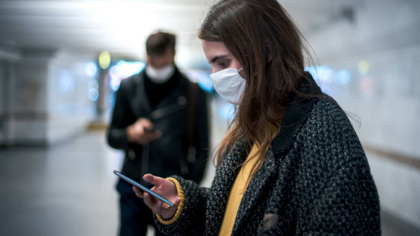 istock group of residents in protective masks walking in the underpass 1250041364