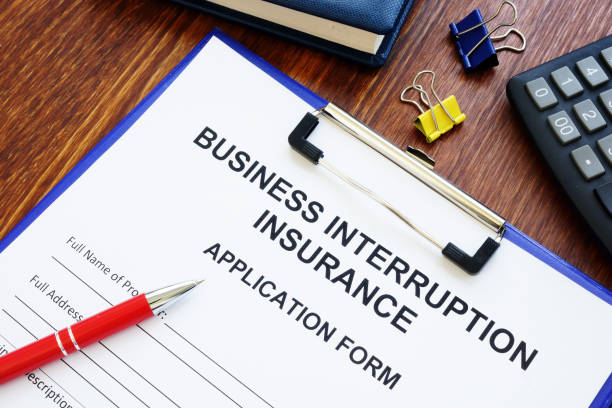 istock Business interruption insurance form and red pen for signing. 1250043029
