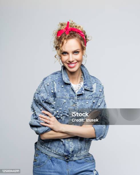 Cheerful Young Woman In 80s Style Outfit Stock Photo - Download Image Now - Arms Crossed, Laughing, Women