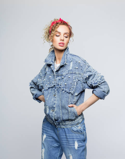 istock Confident young woman in 80's style outfit 1250044902