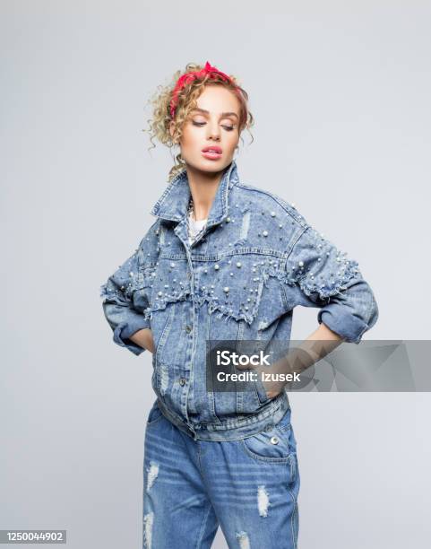 Confident Young Woman In 80s Style Outfit Stock Photo - Download Image Now - Bandana, Women, Denim