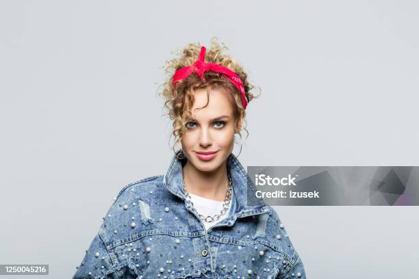 Portrait Of Confident Young Woman In 80s Style Outfit Stock Photo - Download Image Now
