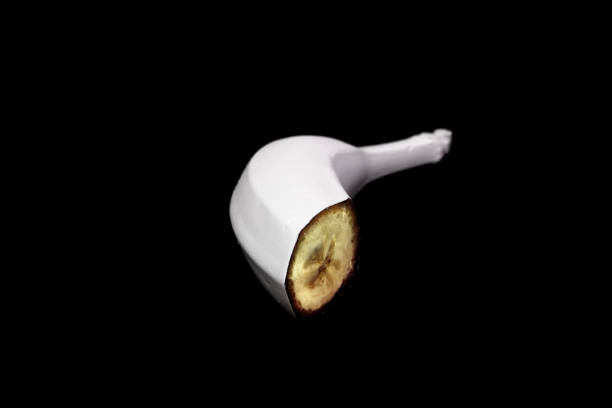 white colored fruits, black background, radiant colors, still life
