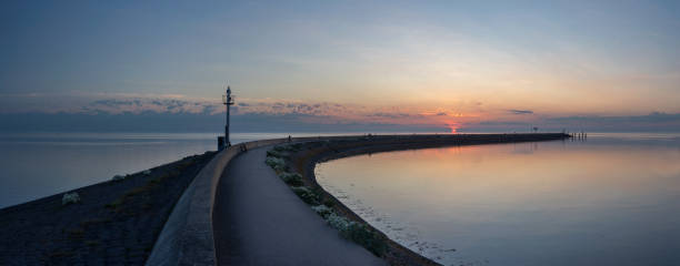 istock Sunset over the harbor of Harlingen 1250046108