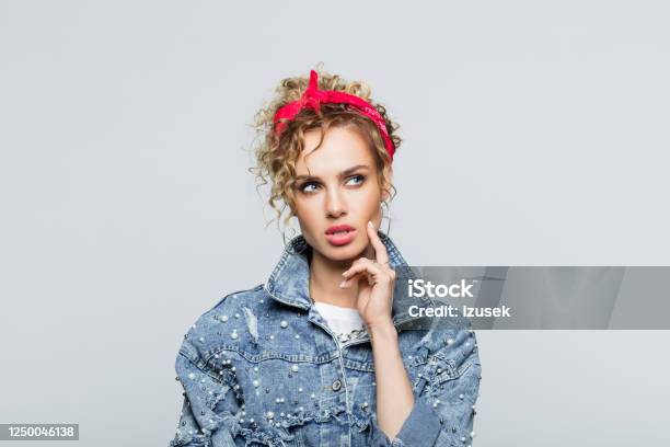 Portrait Of Thoughtful Young Woman In 80s Style Outfit Stock Photo - Download Image Now