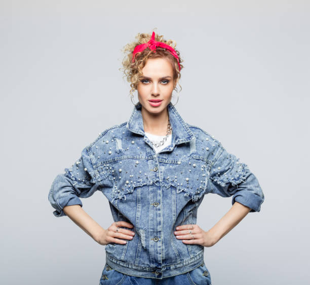 istock Powerful young woman in 80's style outfit 1250046236