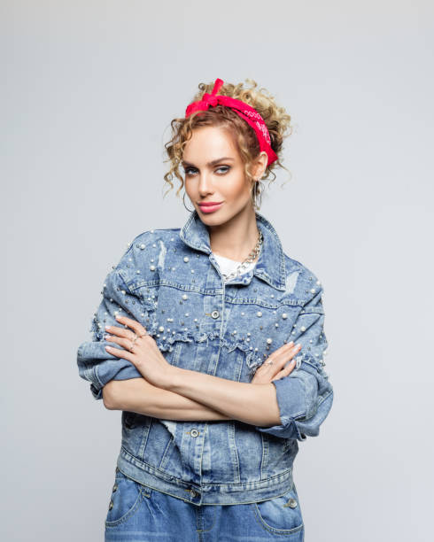 istock Powerful young woman in 80's style outfit 1250046313