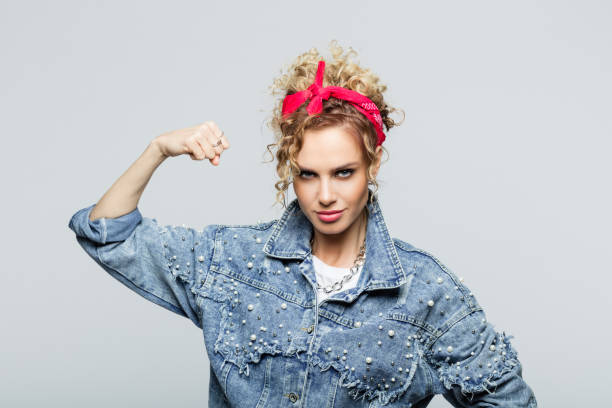 istock Powerful young woman in 80's style outfit 1250046392