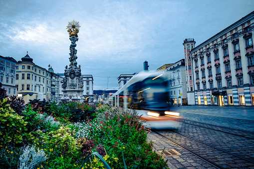 Trinity Column with flowerbed and tramway in Linz, Austria