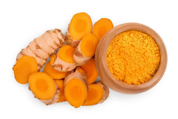 istock Turmeric powder and turmeric root isolated on white background. Top view. Flat lay 1250049379