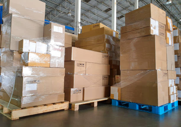 istock Stack of shipment boxes on pallet at the warehouse storage. 1250049472