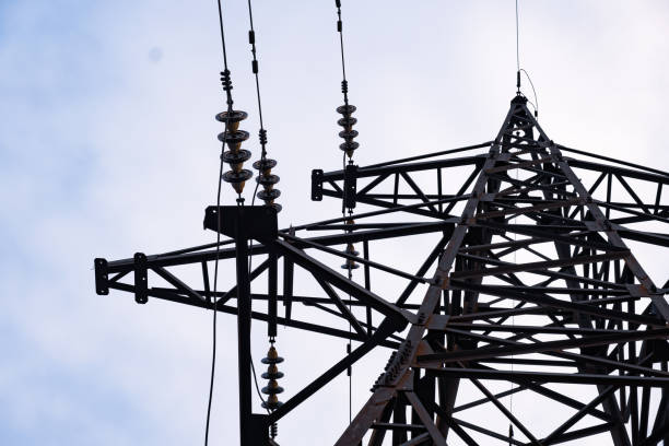 istock Electricity pylons and cabling, back ligth 1250050838