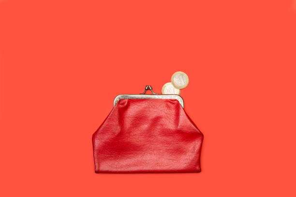 istock Old red coin purse with one euro coins 1250053312
