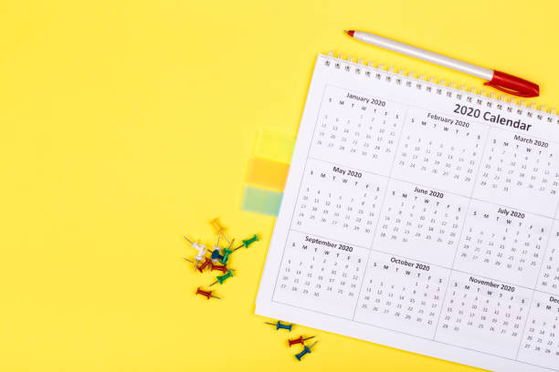 istock White clean calendar 2020  on solid yellow background with copy space, business meeting schedule, travel planning or project milestone and reminder concept. 1250054679