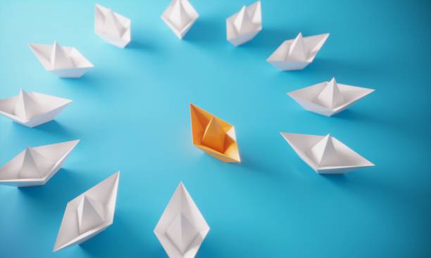 istock Leadership Concept With Paper Boats 1250056392