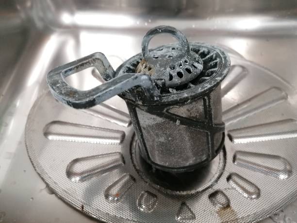 Filter dirty clean from dishwasher stock photo