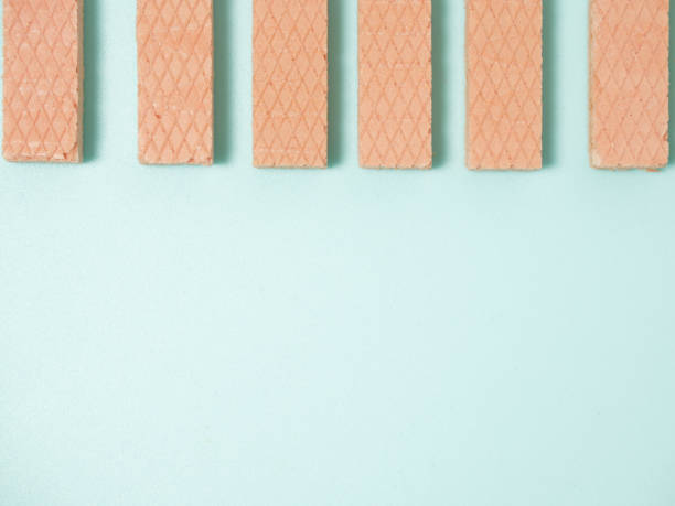 istock Pink Wafers on a colour background 1250060639