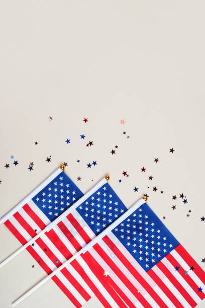 istock Festive background with US flags and confetti. 1250061350