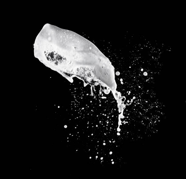 istock White bubble foam splash with water splash on a black background. 1250065523