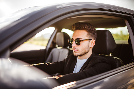 handsome fashion man driving