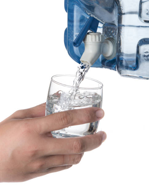 istock Glass filled with drinking water from faucet plastic water container isolated on a white background 1250065717