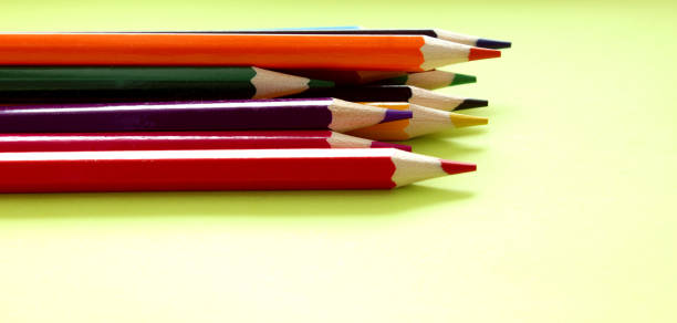 istock Colored pencils on a white background. Lots of different colored pencils. Colored pencil. Pencils are sharp. Pencils lie on the left. Beautiful background. Close-up. Copy space. Background. Flat lay 1250068614