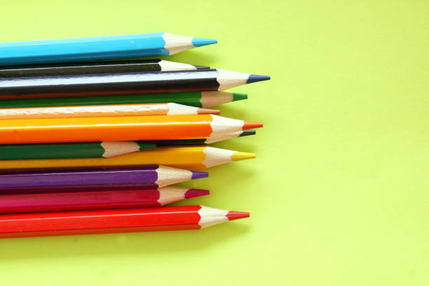istock Colored pencils on a yellow background. Lots of different colored pencils. Colored pencil. Pencils are sharp. Pencils are on the left. Close-up. Copy space. Background. Flat lay. 1250068643