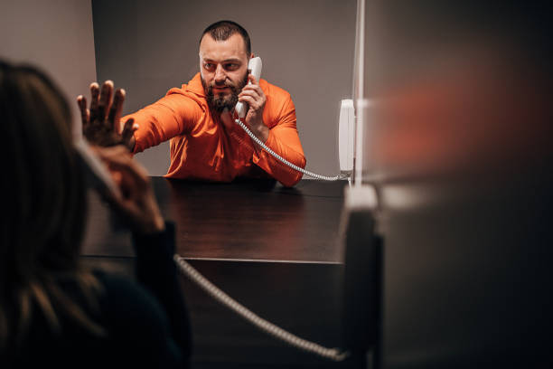 istock Young woman visit her husband in prison 1250068676