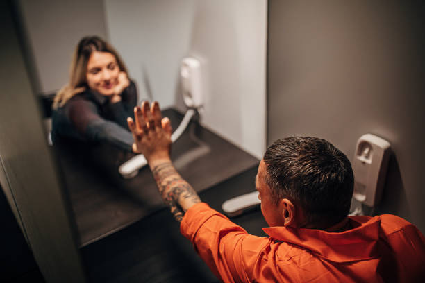 istock Young woman and her husband sitting in visiting room 1250068793