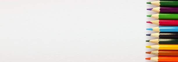 istock Colored pencils on white background. Lots of different colored pencils. Colored pencil. Pencils sharp. Pencils lie on the right. Beautiful background. Close-up. Copy space. Banner 1250068849