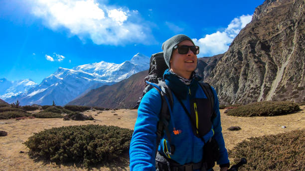 istock Thorung Phedi - A man wandering in Himalayas 1250069920