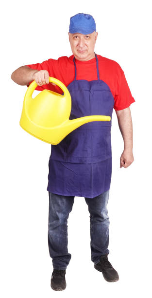 istock Happy gardener with yellow watering can 1250072368