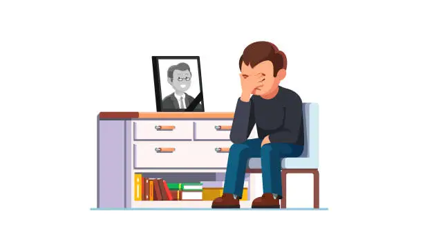Vector illustration of Devastated man mourning over death of colleague or relative suffering from psychological pain & sense of loss. Sitting next to photograph with black ribbon in frame. Flat vector illustration