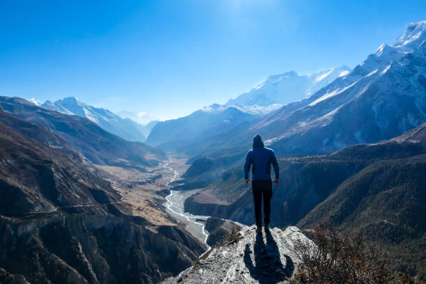 istock Thorung Phedi - A man soaking in the Himalayan view 1250072843