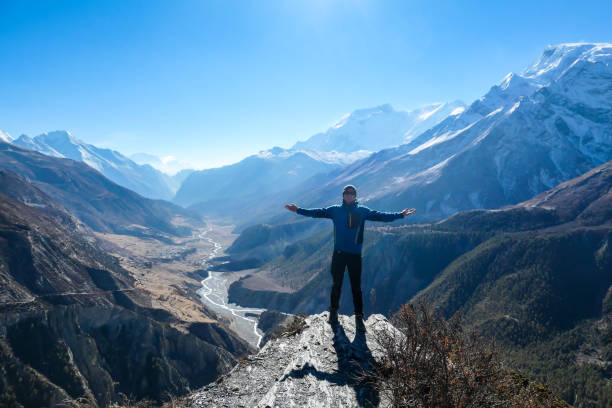 istock Thorung Phedi - A man soaking in the Himalayan view 1250072898