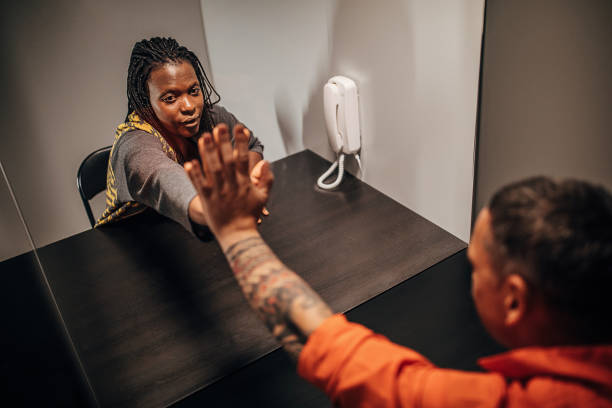 istock Sad young wife visit her husband in prison 1250073028