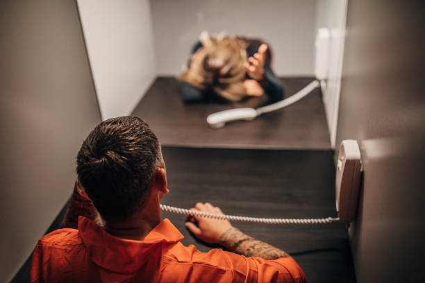 istock Sad woman and her husband in visiting room 1250074373