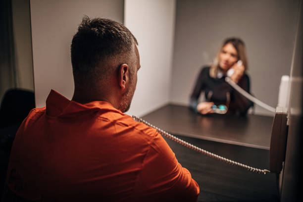 istock One young woman and her husband sitting in visiting room 1250077281