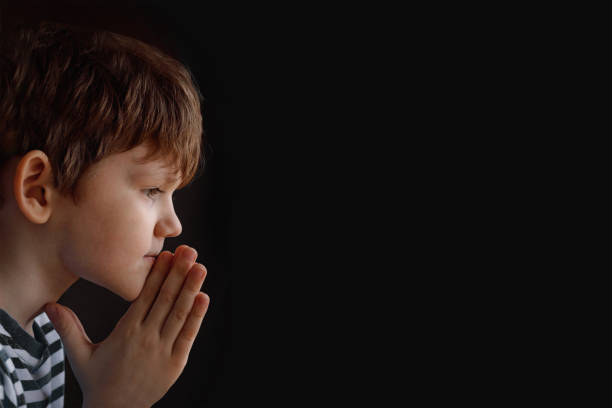 istock Little child folded his hand with praying. 1250077530