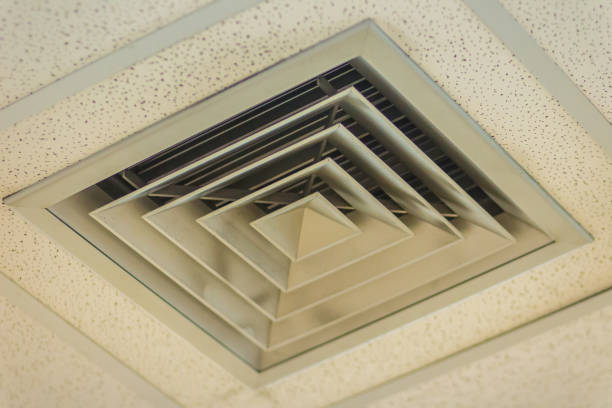 istock Air duct in square shape on the office ceiling. Air condition vent modern air conditioner or air vent on ceiling white, Duct for conditioning heating on a building ceiling 1250078134