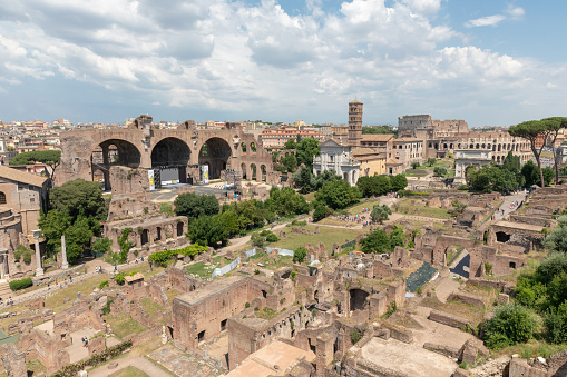 Panoramic view of Roman forum, also known by Forum Romanum or Foro Romano from Palatine Hill. It is a forum surrounded by ruins of ancient government buildings at center of city of Rome
