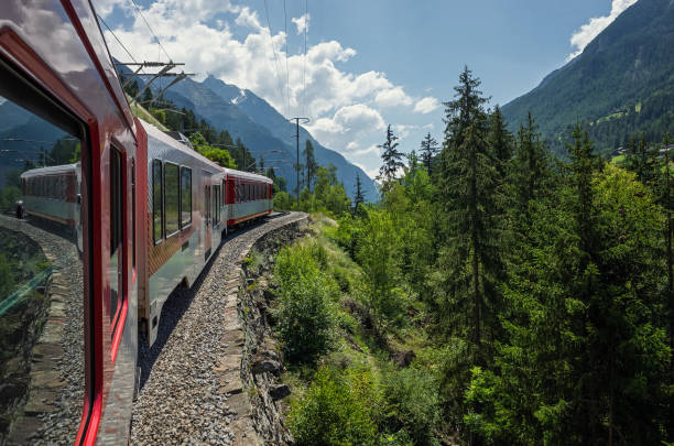 istock The train on the mountain route rises along the slope. 1250078618