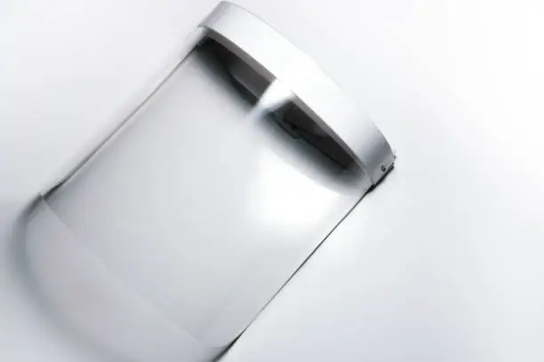 An isolated face shield for protection against COVID 19 in a white background