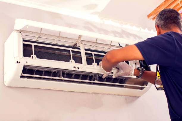 istock Man worker fixing air conditioning on the wall. 1250081810