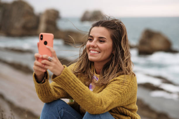 istock Young woman using her smartphone 1250084710