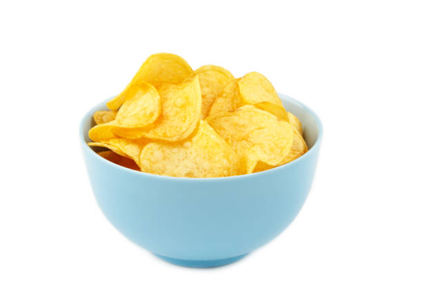 istock Potato chips in blue bowl isolated on white background 1250086717