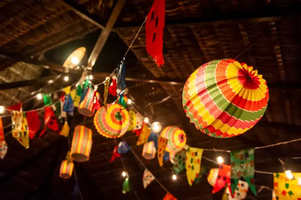Photo of Traditional flags and lanterns of June festivities in northeastern Brazil. Background colorful.